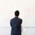 Man looking at whiteboard
